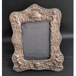 ELIZABETH II SILVER EASEL PHOTOGRAPH FRAME with profuse floral decoration, London 1988 by John