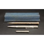 TWO PROPELLING PENCILS one in silver, London hallmarks for 1947; and the other a gold plated Wahl