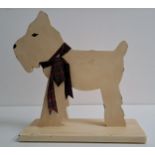 NOVELTY WOODEN DOOR STOP in the form of a West Highland terrier in profile, on a rectangular base,