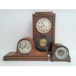 THREE WOODEN CLOCKS comprising a stained pine regulator wall clock, 56cm high; an oak cased Napoleon