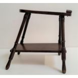 VINTAGE MAHOGANY SHOE SHINE STAND with a shaped foot plate and heel rest marked 7108K to the