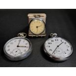 TRAVELLING CLOCK AND TWO POCKET WATCHES the travelling clock in a folding steel case with a circular