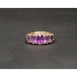 AMETHYST FIVE STONE RING the five graduated oval cut amethysts ranging from approximately 0.7 carats