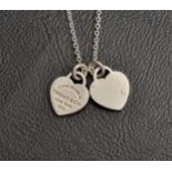 TIFFANY & CO. SILVER MINI DOUBLE HEART TAG SILVER PENDANT on a silver chain