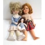 IDEAL DOLL numbered ST-17-1, wearing a tartan dress; together with two bisque headed dolls of