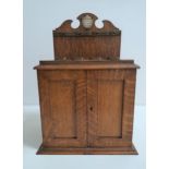 EDWARDIAN OAK SMOKERS CABINET the shaped raised back with a presentation plaque above a stand for