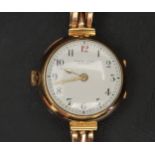 LADIES FIFTEEN CARAT GOLD WRISTWATCH by James Weir Glasgow, the white enamel dial with Arabic