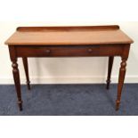 VICTORIAN MAHOGANY SIDE TABLE with a raised back above a moulded D shaped top with a central