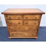 TEAK AND CROSSBANDED CHEST OF DRAWERS with a panelled top above four short and two long drawers with