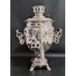 RUSSIAN SILVER PLATED SAMOVAR with shaped side handles and raised on a shaped base with four