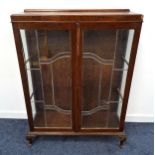 MAHOGANY DISPLAY CABINET with a raised back above a moulded top with glass side panels and leaded