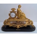 19th CENTURY FRENCH GILT METAL MANTLE CLOCK with a circular enamel dial marked Hry Marc A Paris,