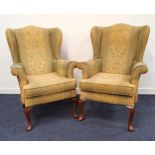 PAIR OF PARKER KNOLL WING BACK ARMCHAIRS covered in a green and yellow textured fabric, standing