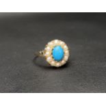 TURQUOISE AND PEARL CLUSTER RING the central cabochon turquoise in a twelve pearl surround, on