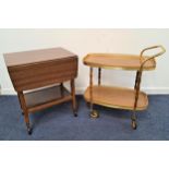 TEAK EFFECT TEA TROLLEY the two tiers with pierced gilt metal raised sides, 78.5cm high, together