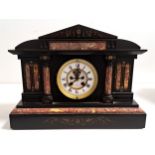 VICTORIAN BLACK SLATE AND MARBLE MANTEL CLOCK of architectural outline with a circular brass and