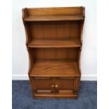 ERCOL ELM WATERFALL BOOKCASE with two open shelves and shaped sides above a pair of panelled