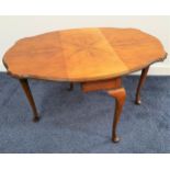 WALNUT OCCASIONAL TABLE with shaped drop flaps, standing on cabriole supports, 61cm wide