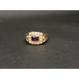 AMETHYST AND PEARL CLUSTER RING the central horizontally set rectangular cut amethyst in a