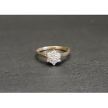 PRETTY DIAMOND CLUSTER RING the seven diamonds totalling approximately 0.33cts, on nine carat gold