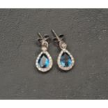PAIR OF DIAMOND AND BLUE TOPAZ METAMORPHIC EARRINGS the diamond stud set posts with removable
