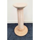 LIMED OAK PEDESTAL raised on a circular stepped base with a carved column and circular top, 71cm