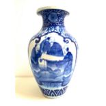 EARLY 20th CENTURY JAPANESE BLUE AND WHITE VASE of baluster form decorated with flowers and two