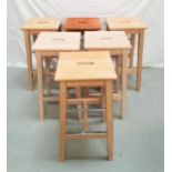 SET OF SIX OAK KITCHEN STOOLS with rectangular tops with a hand hole, on tapering supports united by