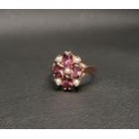 RHODOLITE AND SEED PEARL CLUSTER RING the four oval cut rhodolites interspersed with five seed
