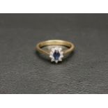 PRETTY SAPPHIRE AND DIAMOND CLUSTER RING the central oval cut sapphire approximately 0.25cts in