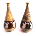 PAIR OF ROYAL DOULTON STONEWARE SPILL VASES of conical form and decorated with a mottled green