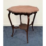 EDWARDIAN MAHOGANY WINDOW TABLE with a circular shaped top and frieze, standing on cabriole supports