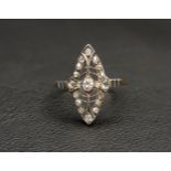 ART DECO DIAMOND SET RING of pierced marquise shaped plaque design, the central diamond