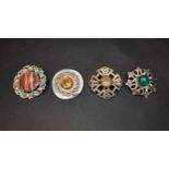 FOUR GEM AND STONE SET SILVER BROOCHES comprising a John Hart Iona silver brooch with central banded