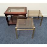 PAIR OF OCCASIONAL TABLES with square smoked glass tops on brass effect supports, 37.5cm x 42.5cm,