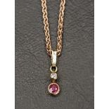 NINE CARAT ROSE GOLD NECKCHAIN with a diamond and ruby pendant, approximately 4.8 grams