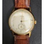 GENTLEMAN'S ROLEX EIGHTEEN CARAT GOLD CASED WRISTWATCH circa 1940s, the dial with Arabic numerals