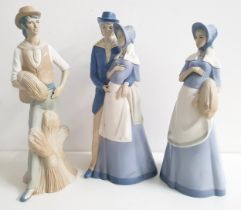 THREE MIQUEL REQUENA PORCELAIN FIGURINES comprising a farmer holding a sheaf of corn, 45cm high,