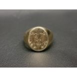 NINE CARAT GOLD SIGNET RING the oval signet ring engraved with an ornamental 'M', approximately 8.