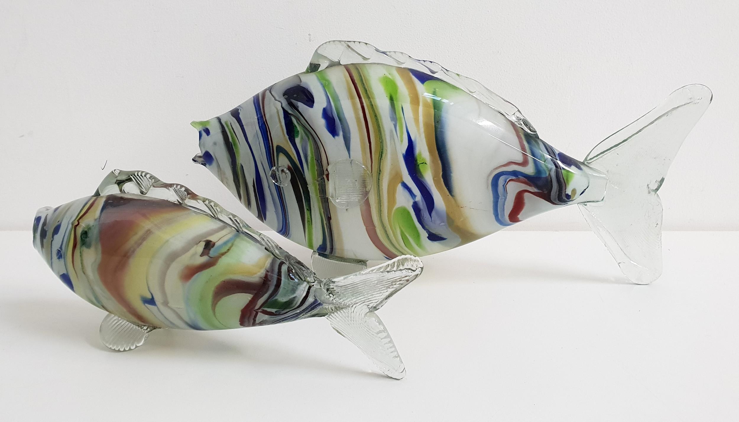 PAIR OF GRADUATED 20th CENTURY GLASS FISH with a multi coloured bodies and clear glass fins and