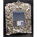 ELIZABETH II BRITANNIA SILVER PHOTOGRAPH FRAME decorated with putti in relief, London 1997 by Neil