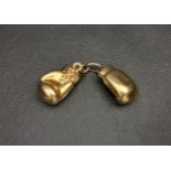 SINGLE NINE CARAT GOLD BOXING GLOVE CUFFLINK approximately 2.9 grams Note: could be repurposed as