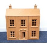 CHILD'S DOLL HOUSE constructed from ply, the double fronted house opening to reveal rooms,
