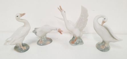 FOUR LLADRO GEESE FIGURINES one standing 4552, 11.5cm high, one preening it's feathers 4553, 10.