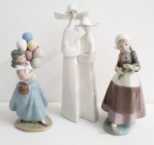 THREE LLADRO FIGURINES comprising two nuns with rosary beads 4611, 33cm high, Dutch girl with