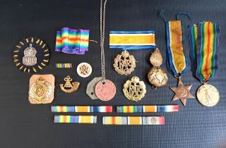 SELECTION OF MILITARY BADGES AND MEDALS including a WWI victory medal, The 1934-1945 Star, various