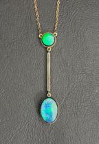 OPAL TRIPLET PENDANT un marked gold, the round opal above thin bar and further oval opal drop, on