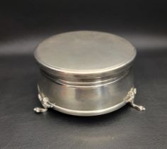 SILVER TRINKET BOX the circular box raised on three paw feet, with hinged cover and velvet lined