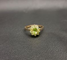 PRETTY PERIDOT CLUSTER RING the darker central oval cut peridot with a surround of ten lighter