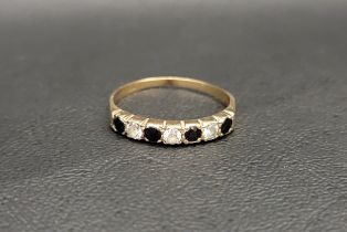 SAPPHIRE AND CZ SEVEN STONE RING in nine carat gold, ring size T and approximately 1.6 grams